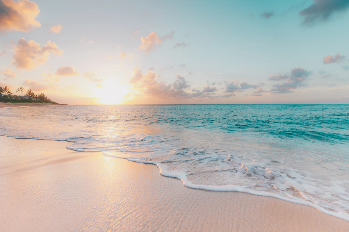 Soft sunlight over an open, quiet shore